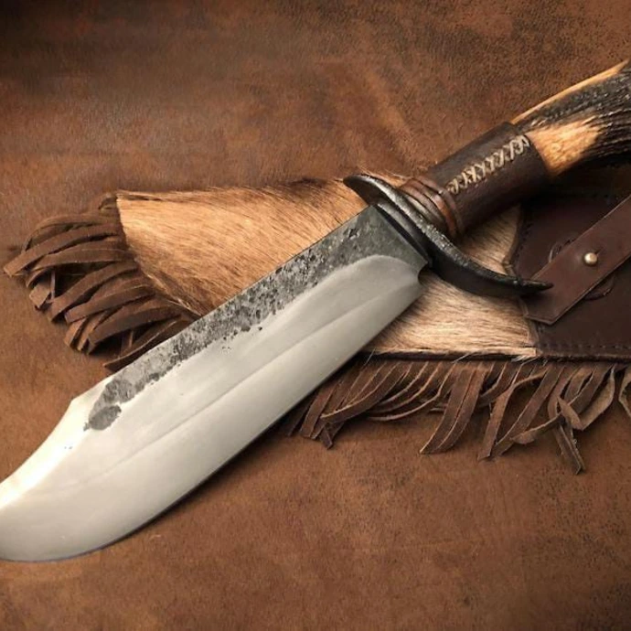 Hand-forged custom fixed blade knife with leather handle and leather sheath