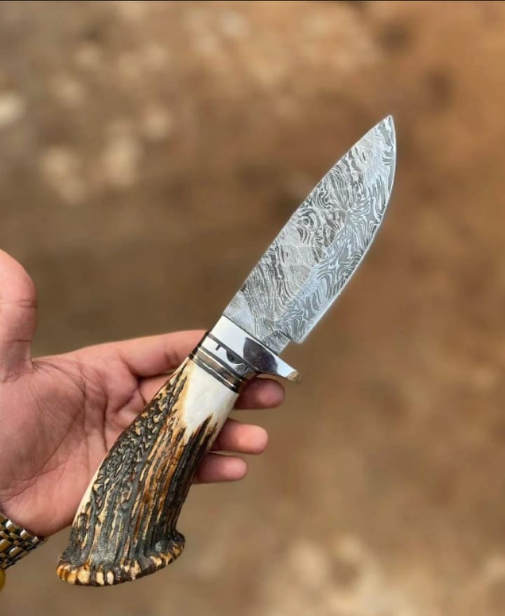 Handcrafted hunting knife fitted with a rugged, genuine stag antler handle